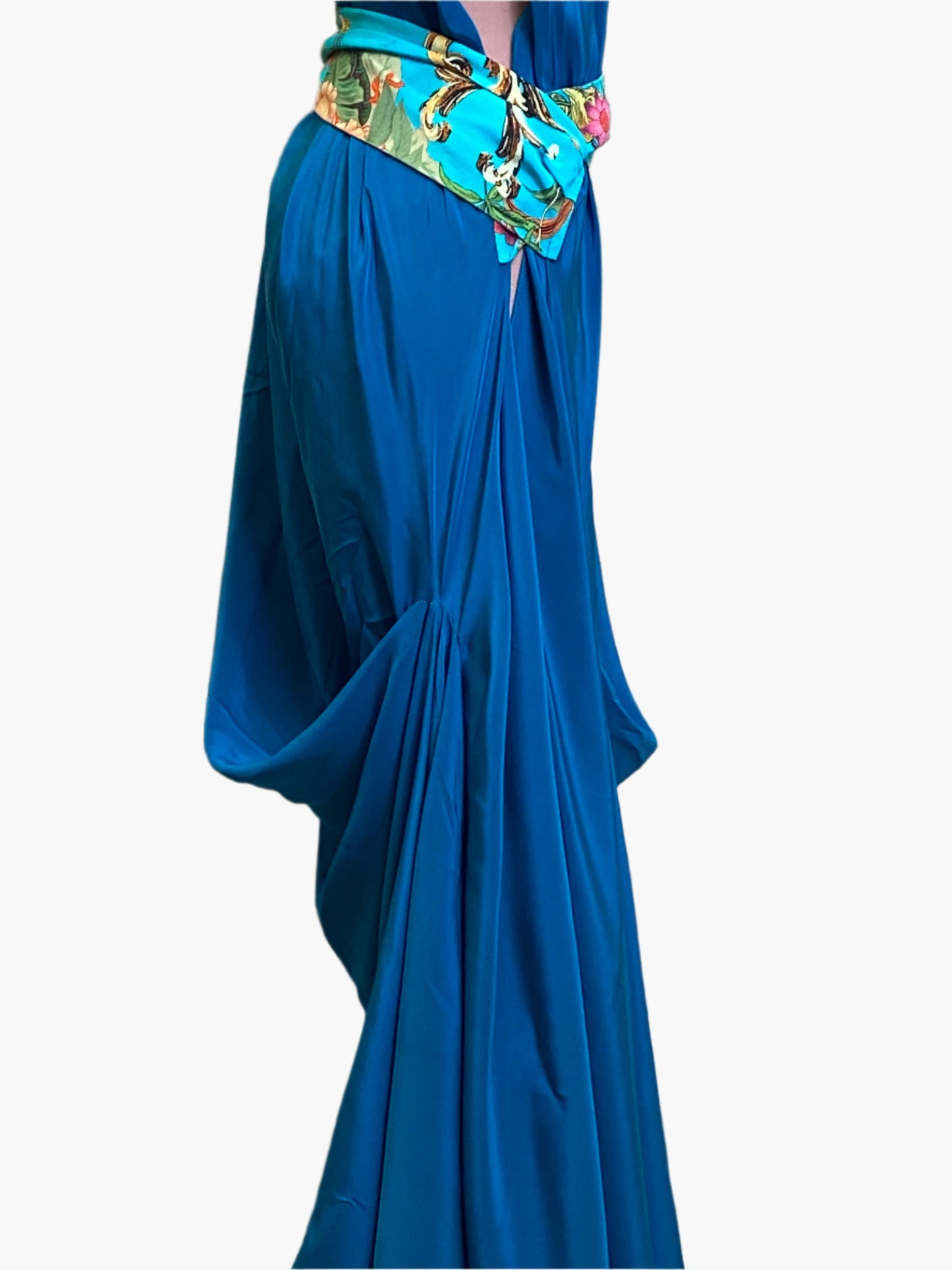 Elegant turquoise silk goddess dress with flowing drape and flattering silhouette.Wide attached multicoloured sash belt.